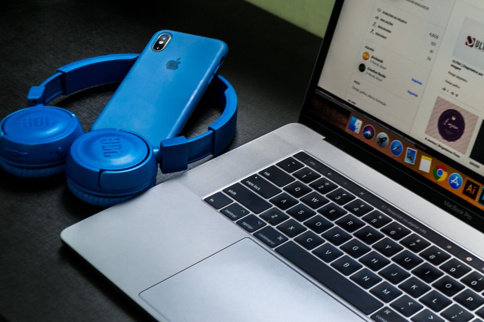 Headphones resting on laptop
