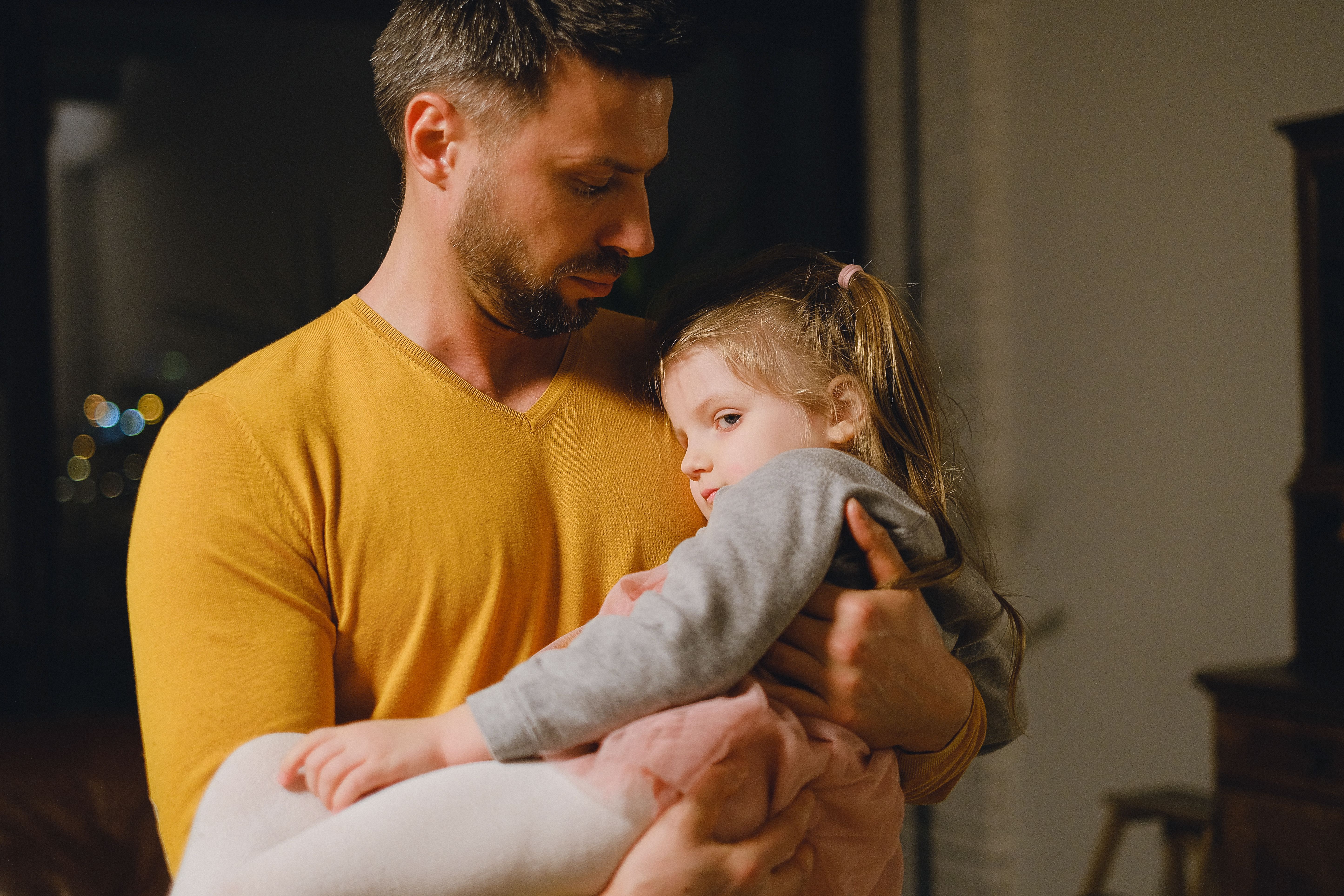 parent comforting young child