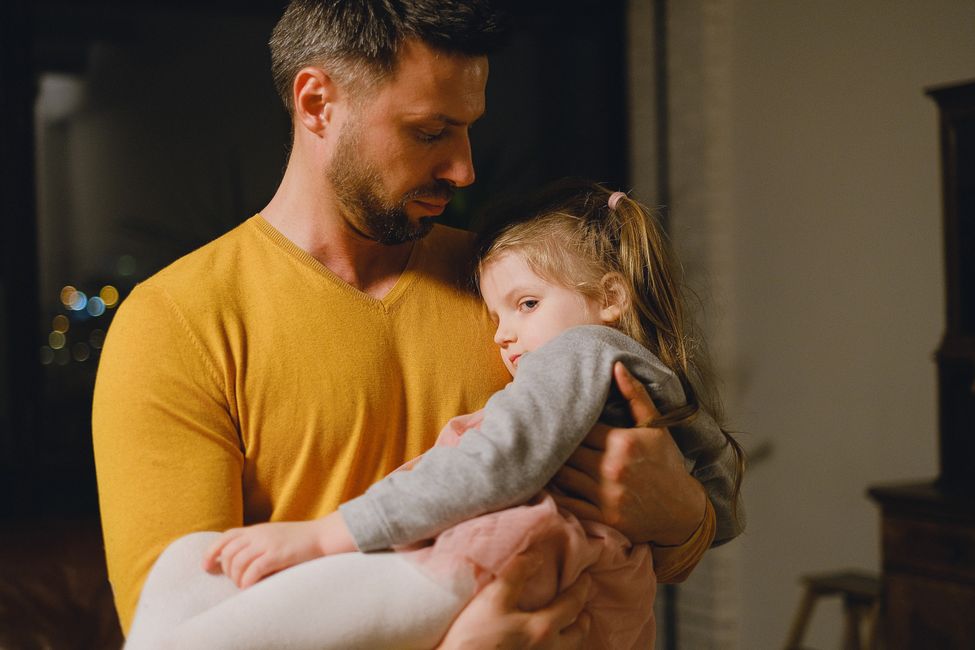 parent comforting young child