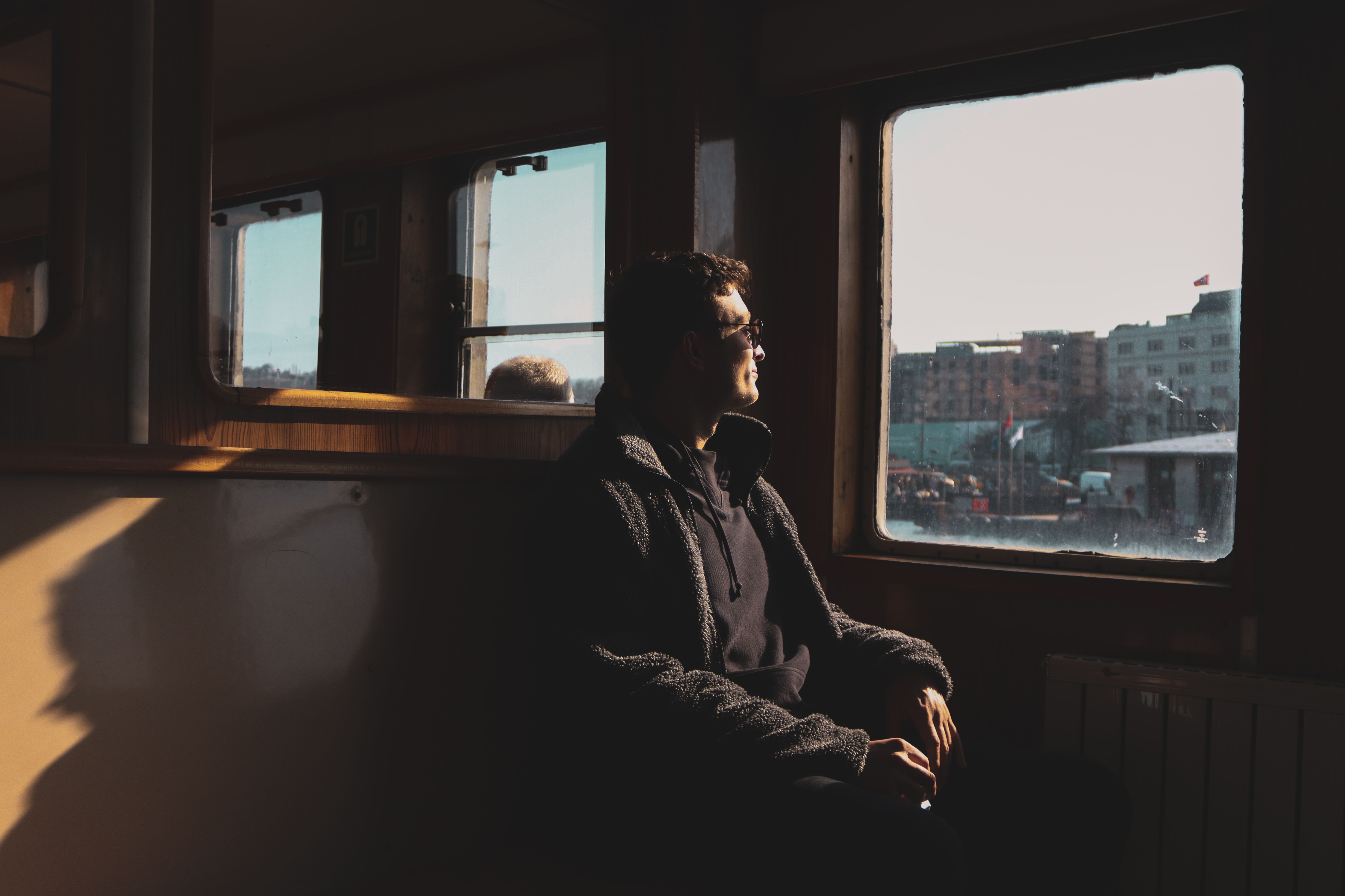 person looking thoughtful window