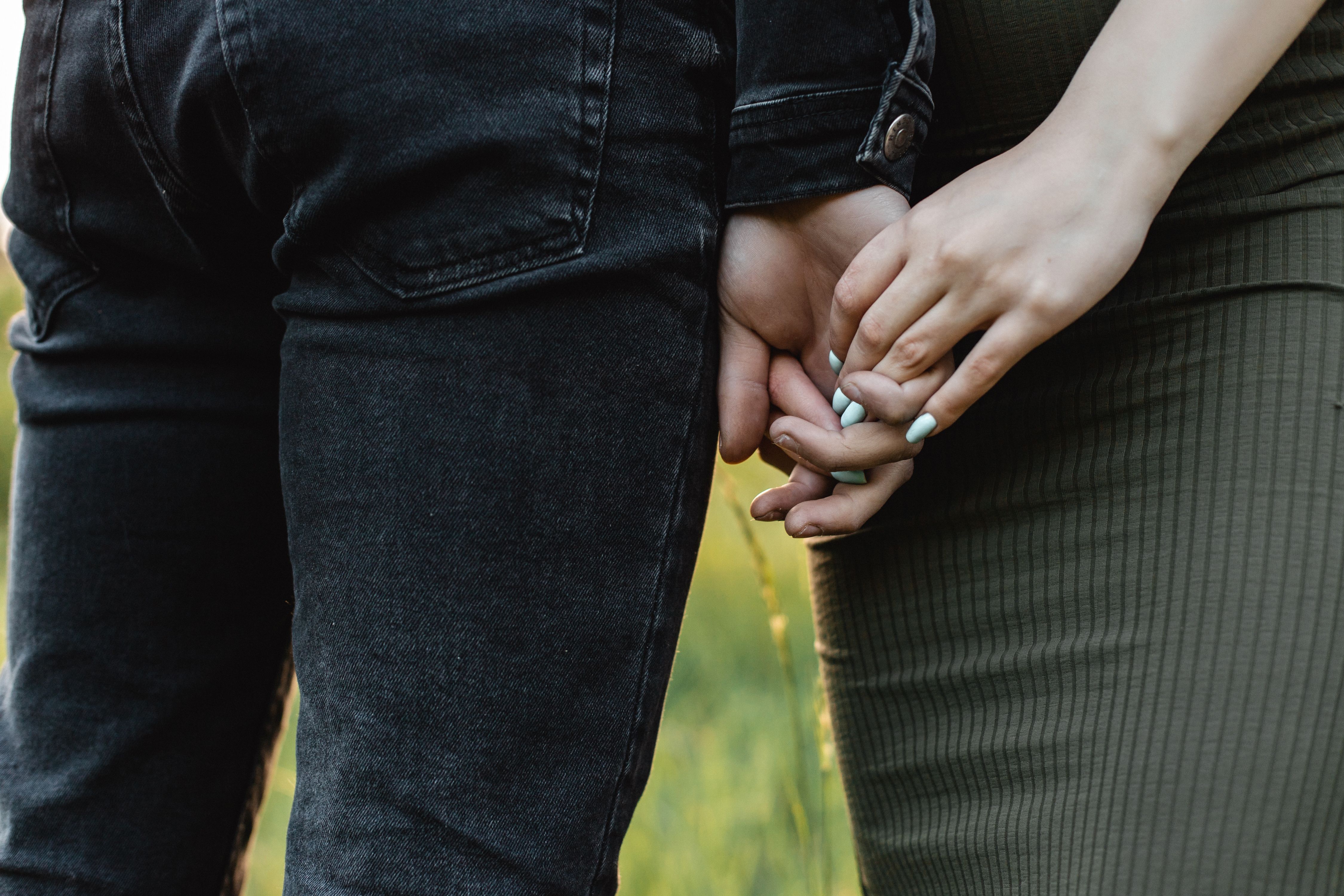 hands holding gently together