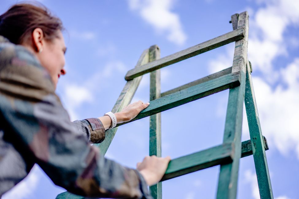 person climbing upward path
