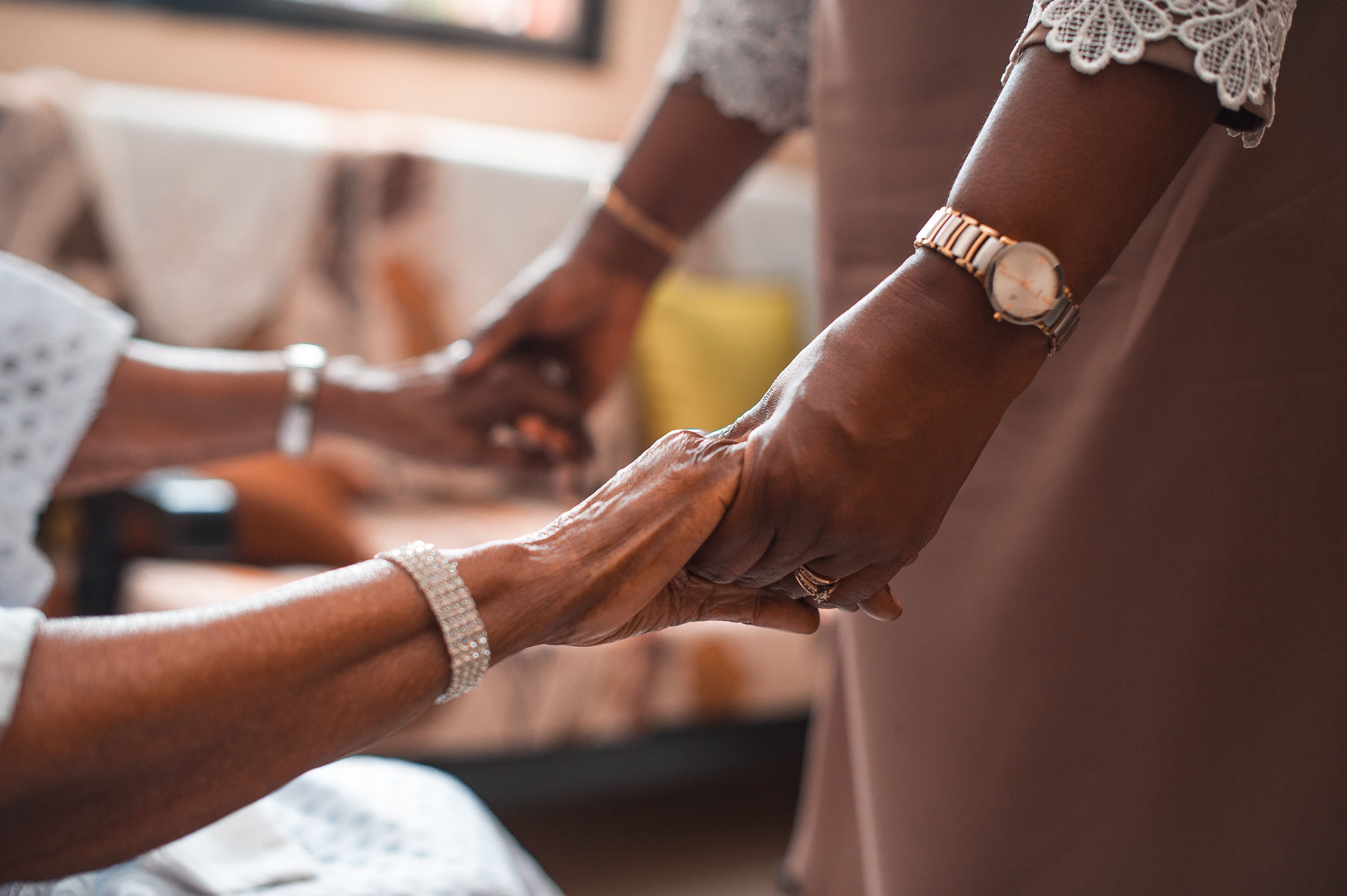 elderly hands holding support