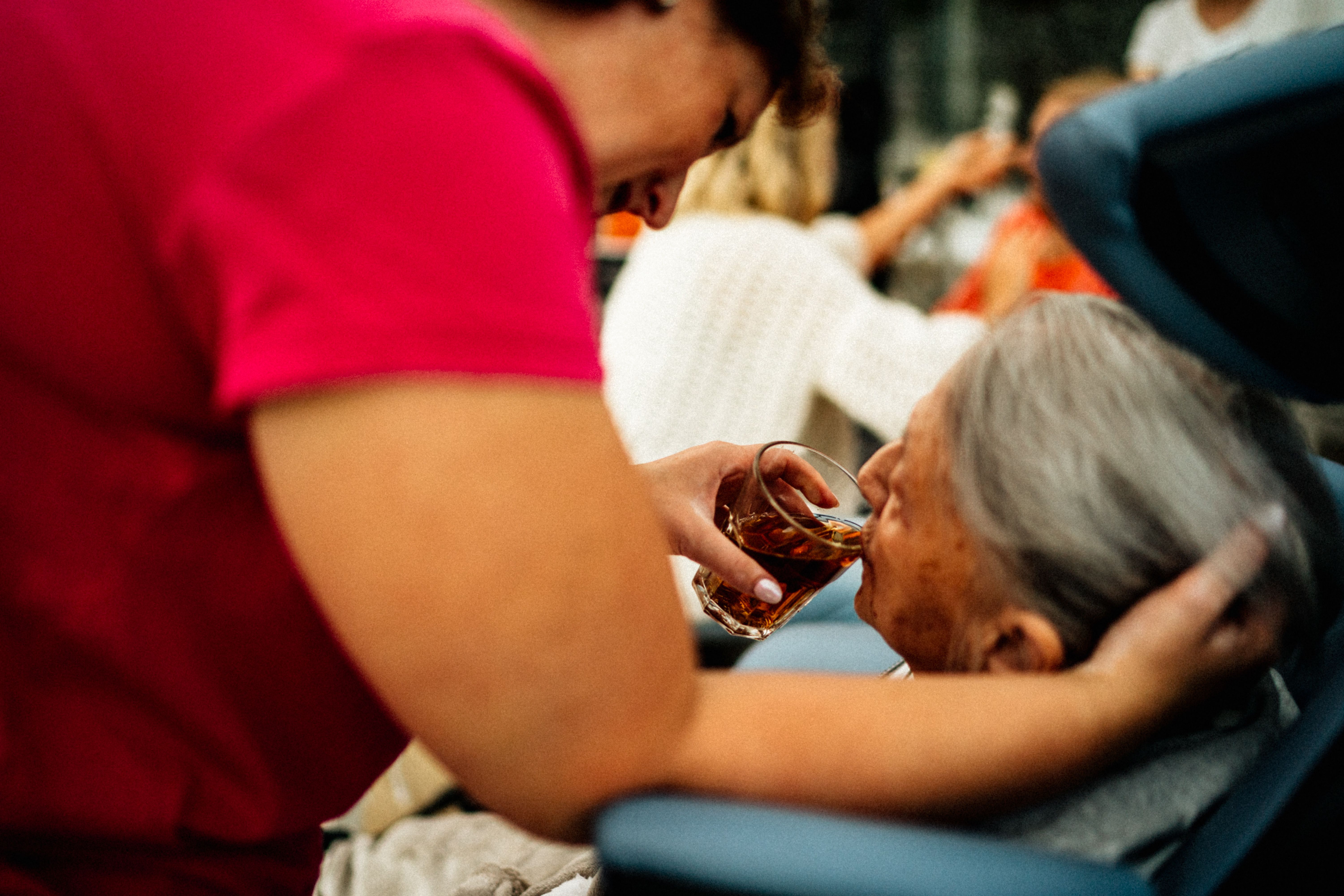 caregiver supporting elderly person
