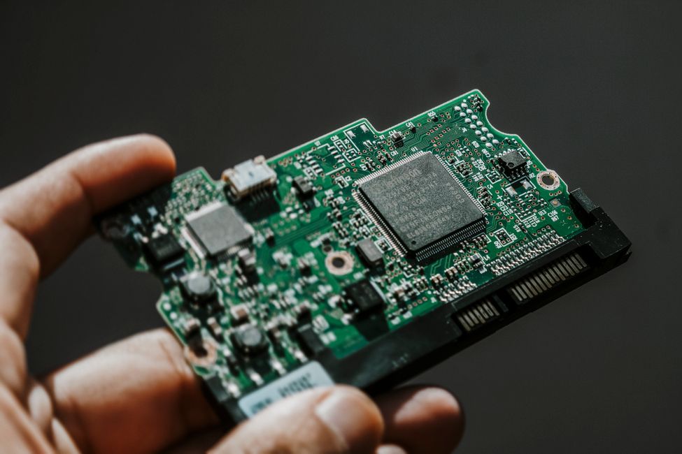 scientist holding microchip device