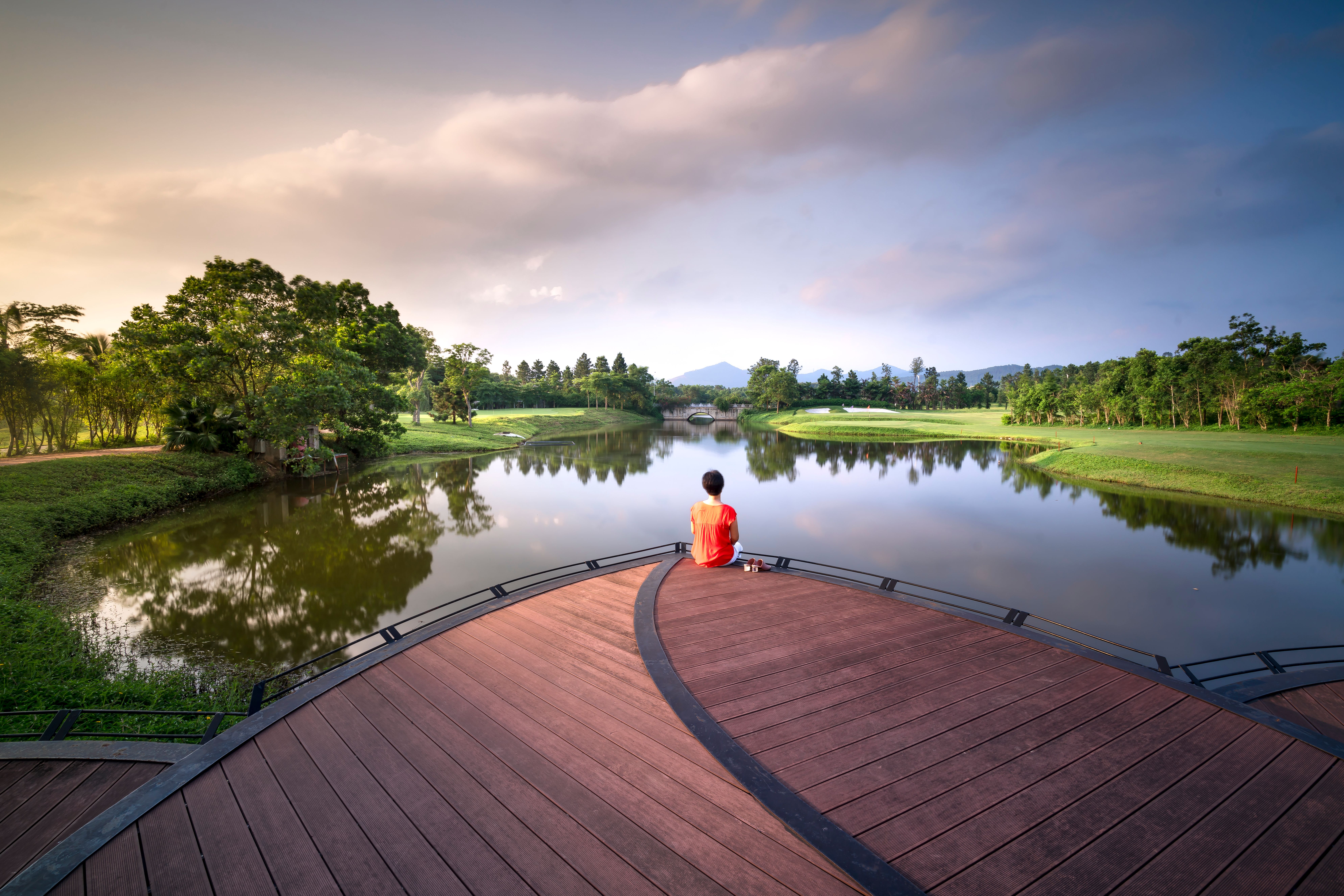person sitting peacefully outdoors