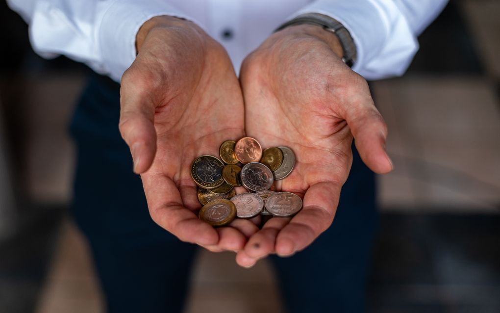 hands sharing coins together