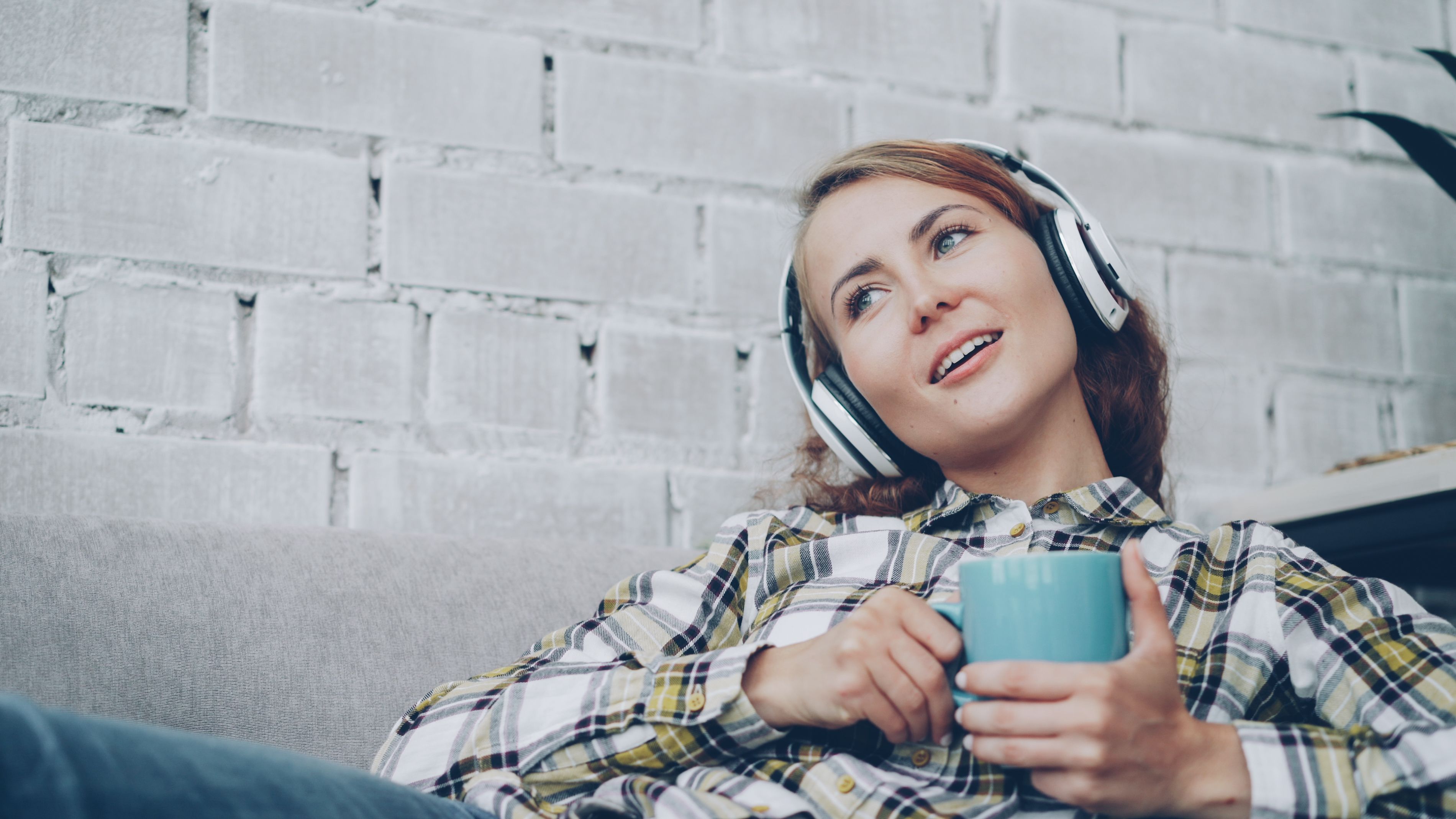 Person listening with coffee