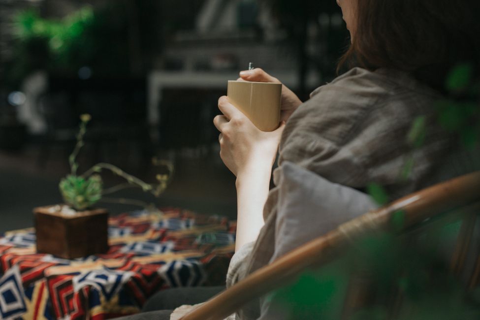 person resting with coffee