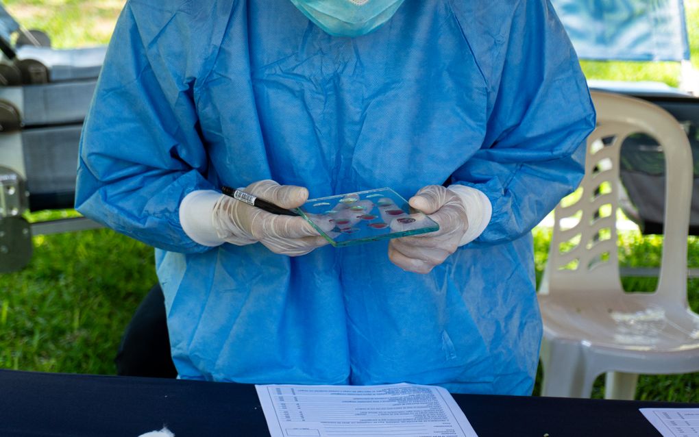 person providing saliva sample