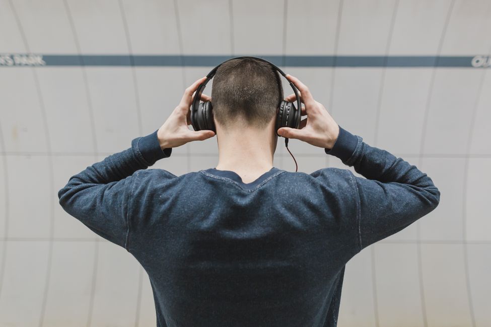 Person listening with headphones