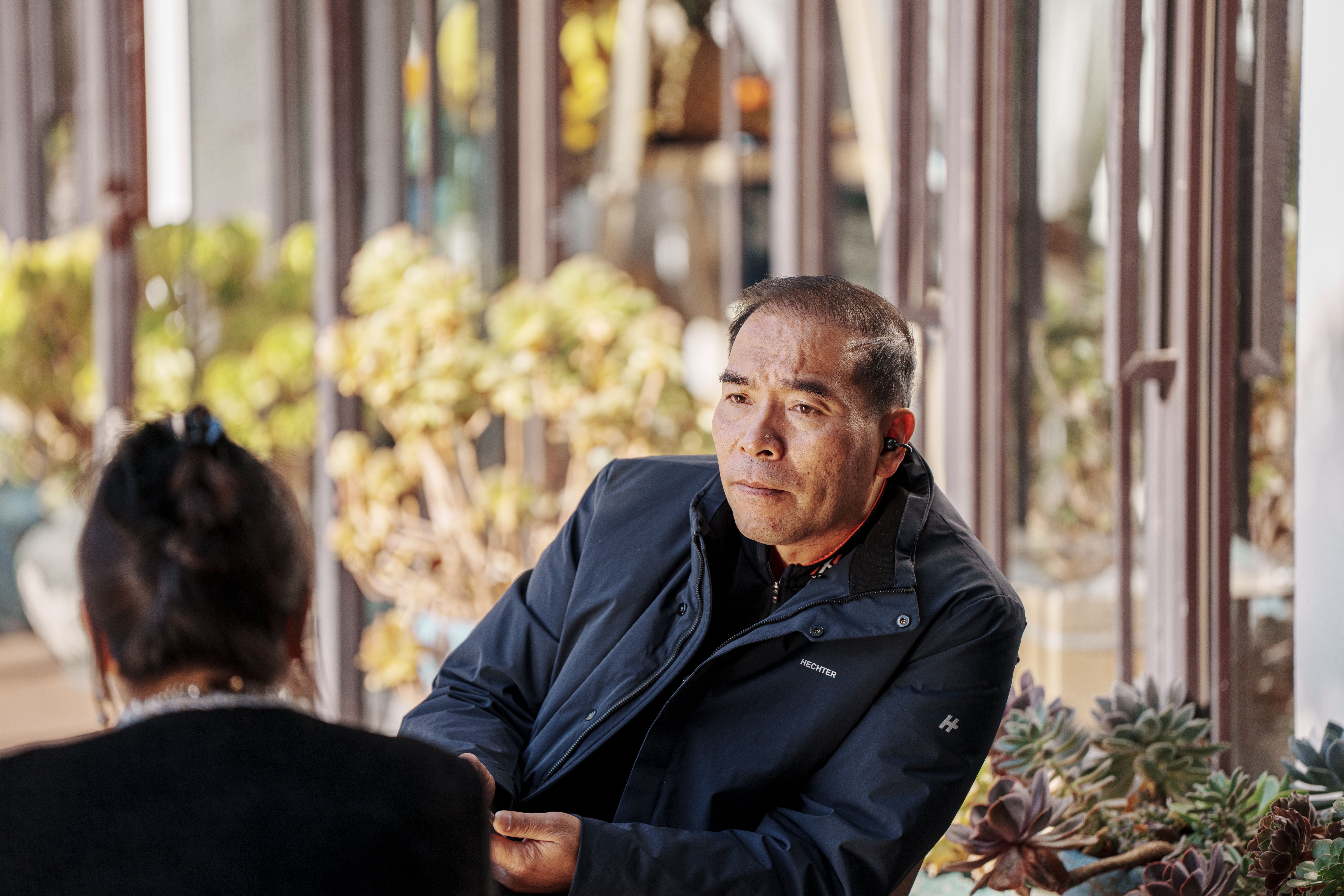 two people talking outdoors