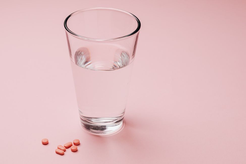 pills and glass of water