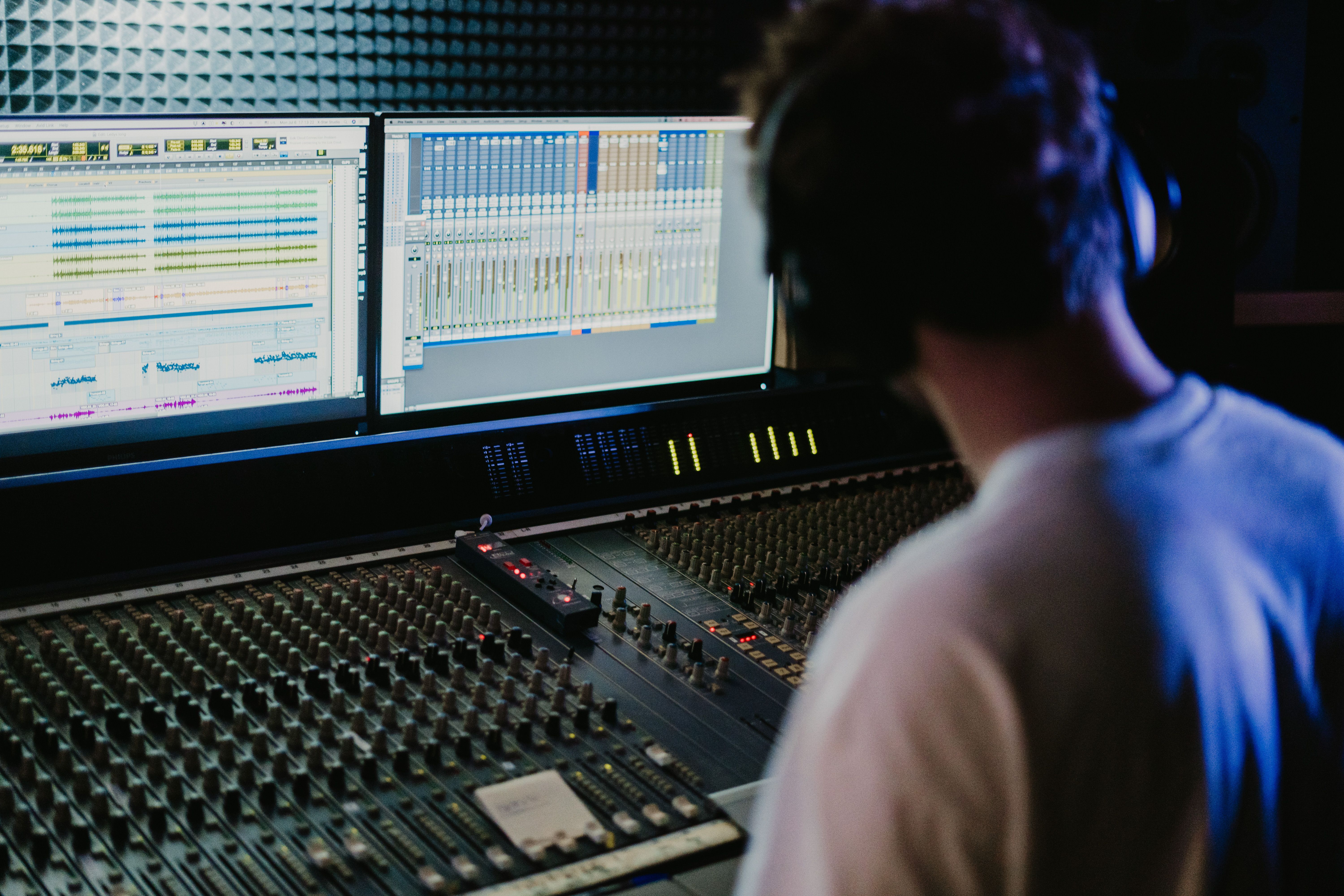person editing audio headphones