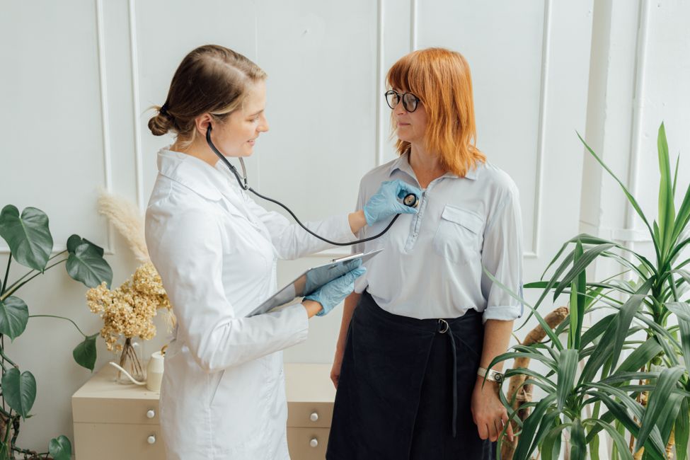 doctor listening to patient