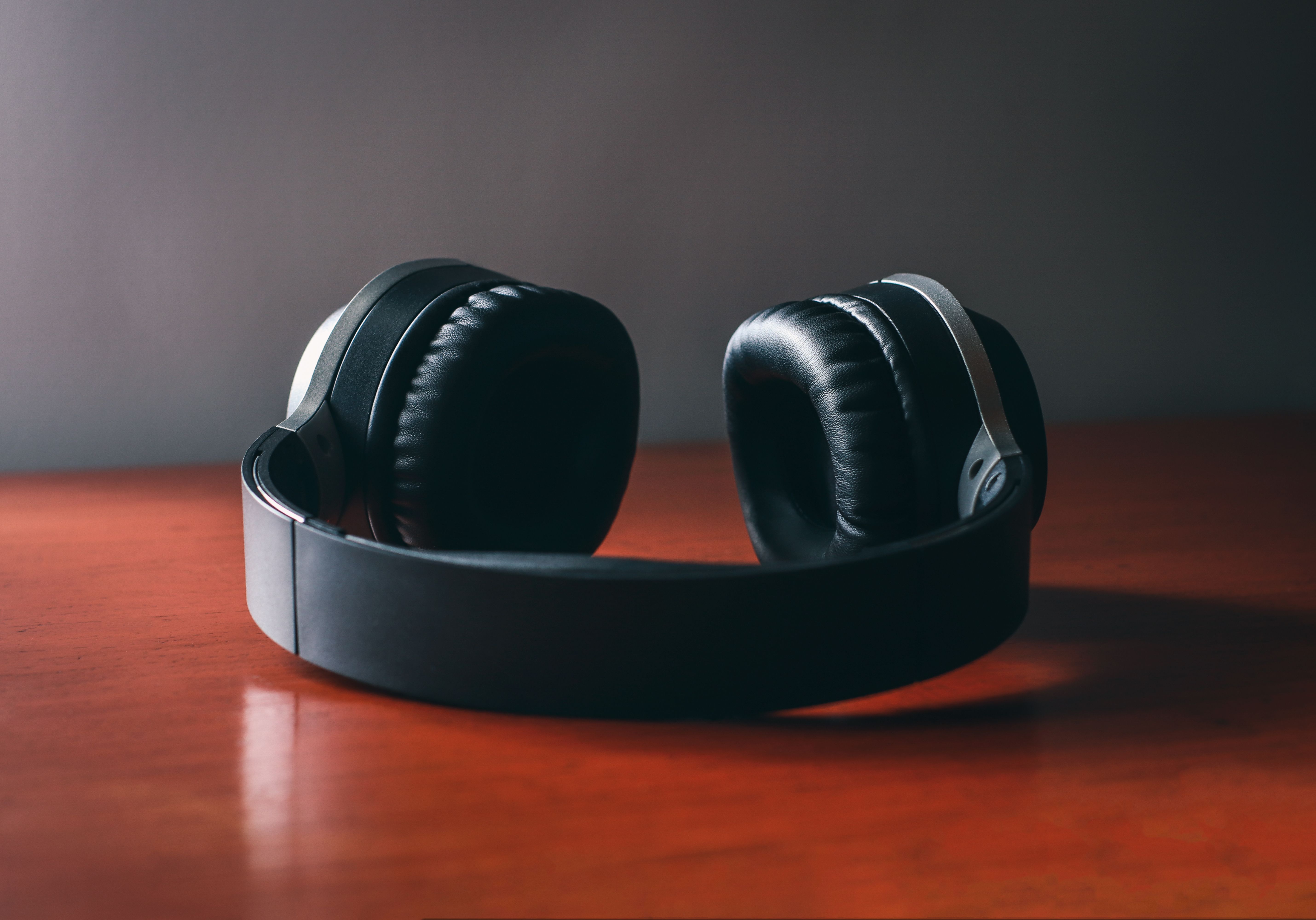 headphones on wooden desk