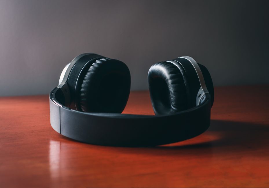 headphones on wooden desk