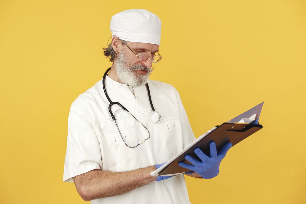 adult holding medical records thoughtfully