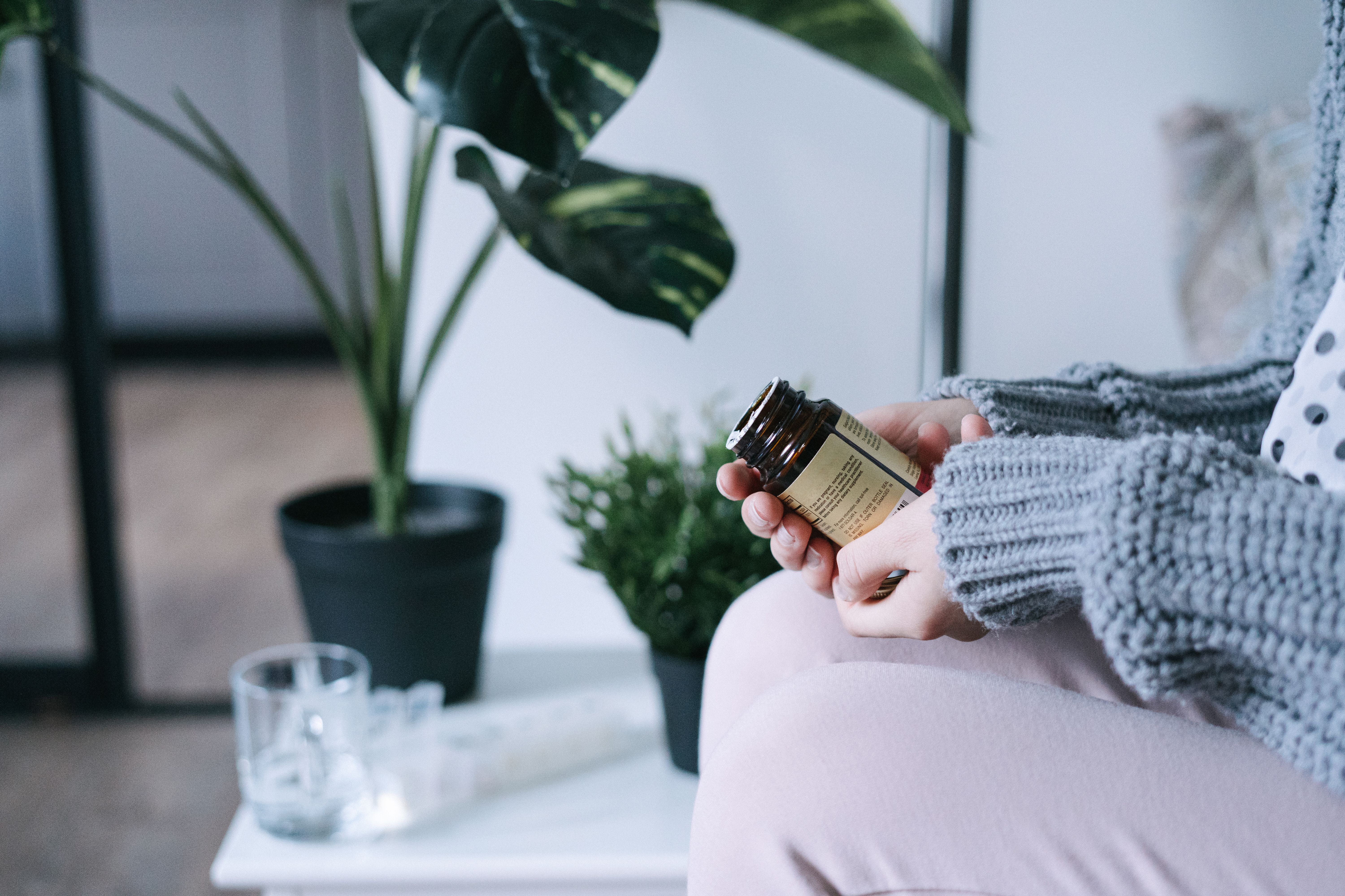 person holding medication bottle