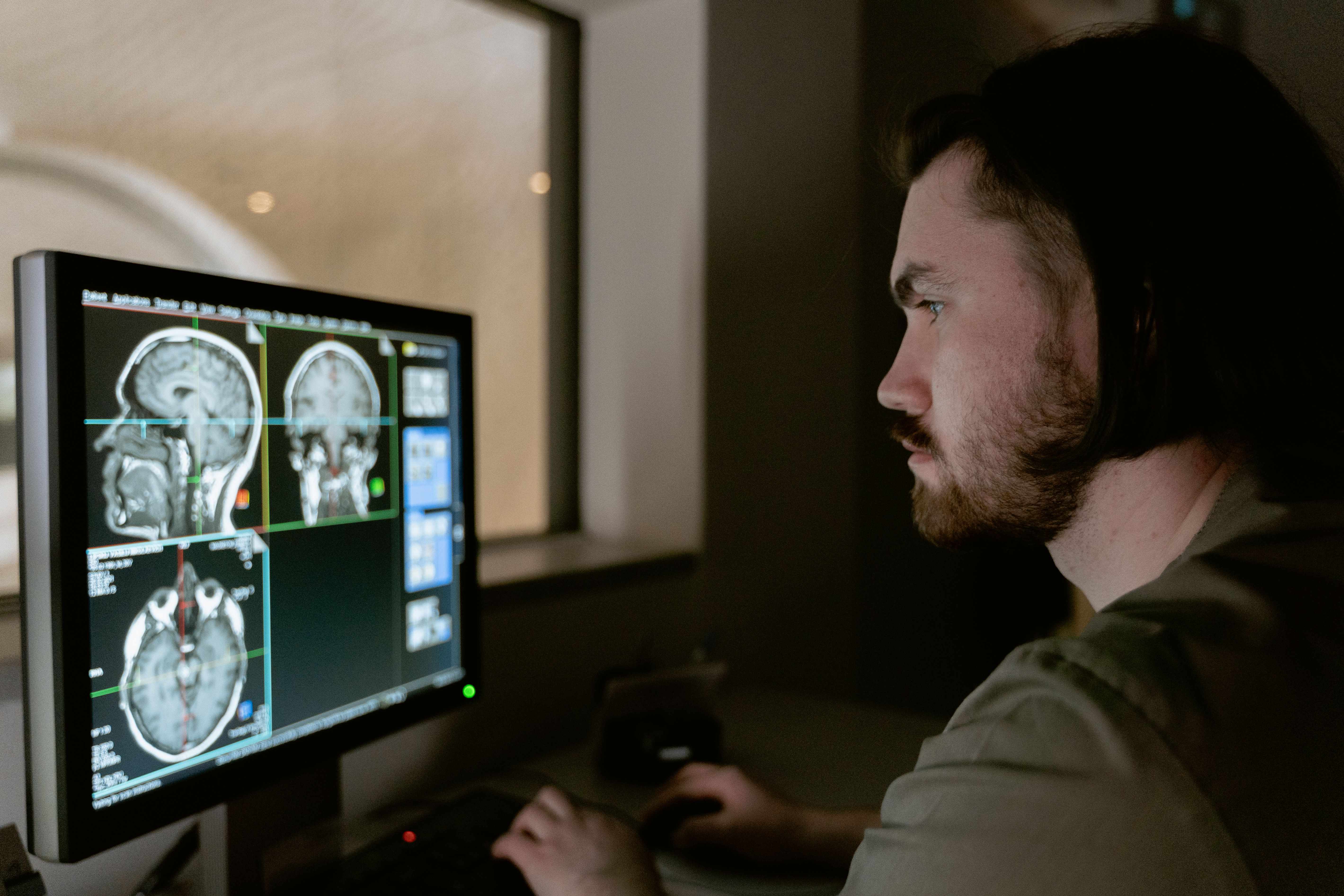researcher examining brain scan