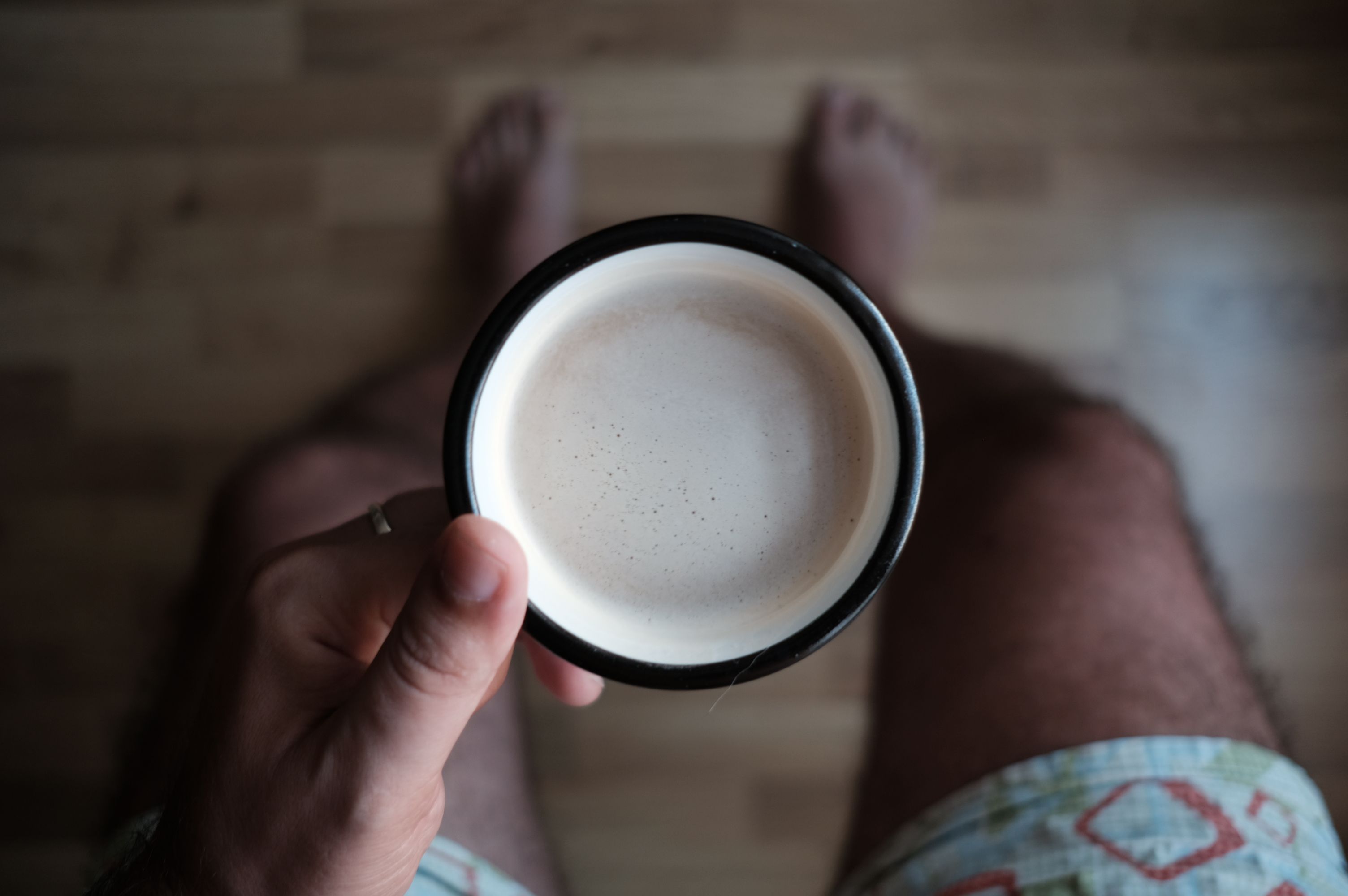 hands holding morning coffee