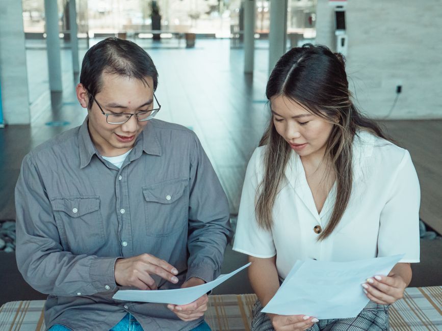 people reviewing documents together