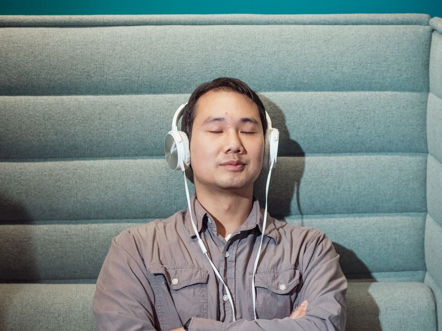 person listening with headphones