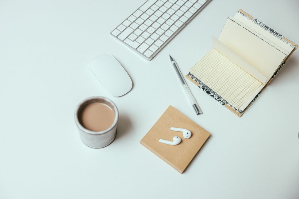 Notepad and coffee workspace