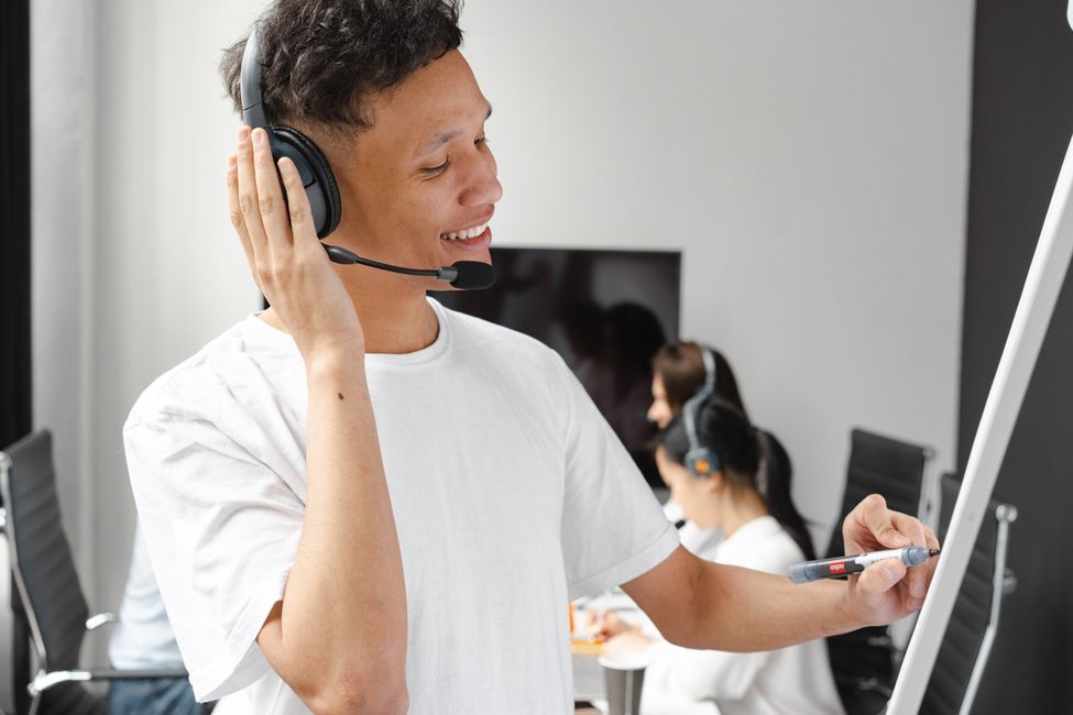 person speaking with headphones
