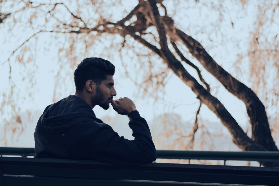 person thinking peacefully outdoors