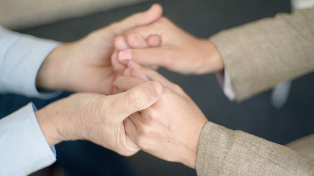 hands holding with gentle support