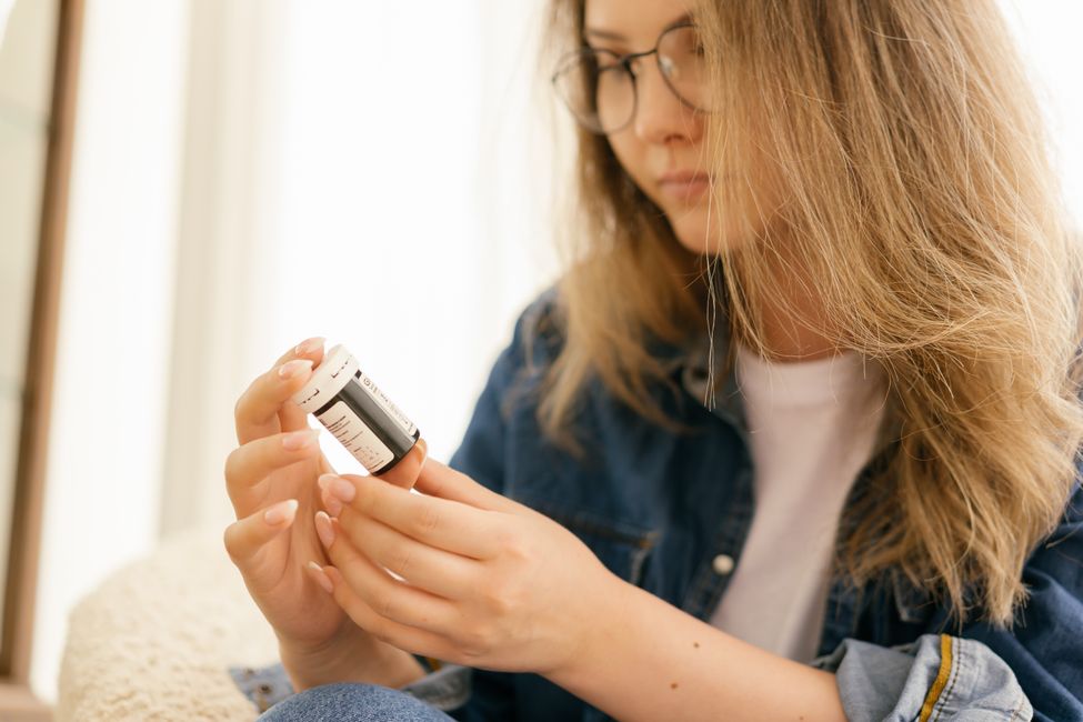 person holding prescription bottle