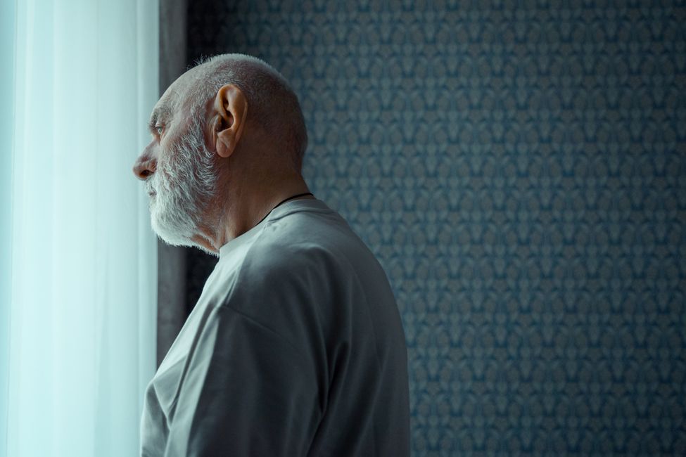 elderly person thoughtful moment